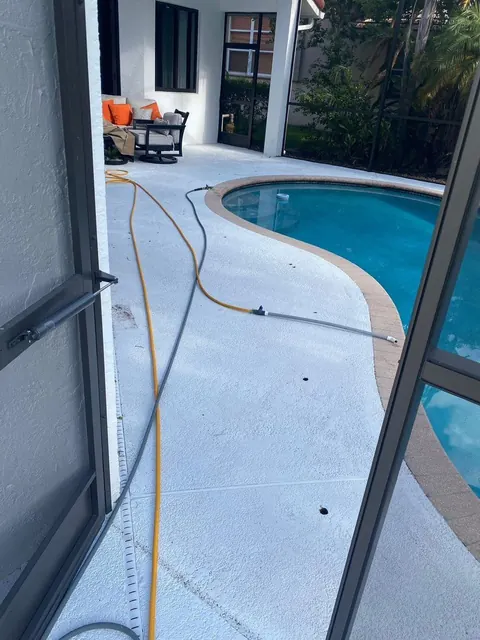 Screened pool deck with cleaning equipment
